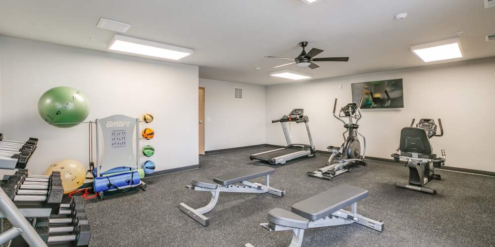 Well-equipped fitness center with multiple treadmills at Whitetail Ridge in Salem, Wisconsin