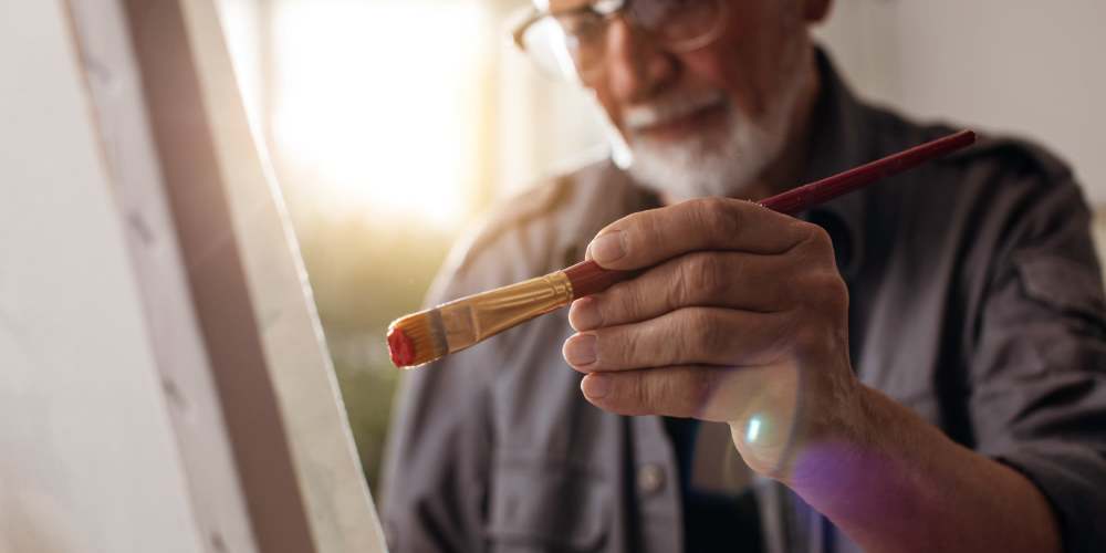 Resident painting near Eva Manor in Pleasant Prairie, Wisconsin