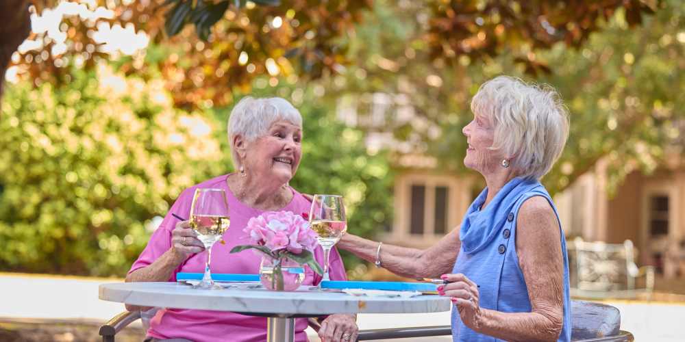 Two women sitting outside at The Barclay at Santa Rosa Beach in Santa Rosa Beach, Florida