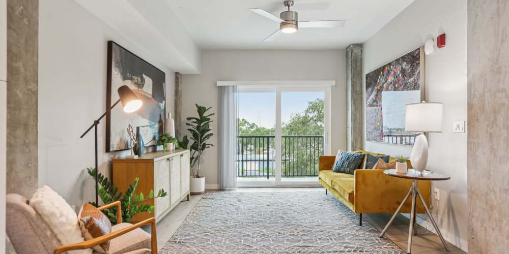 Living room with attached patio at The Breeze in Winter Haven, Florida