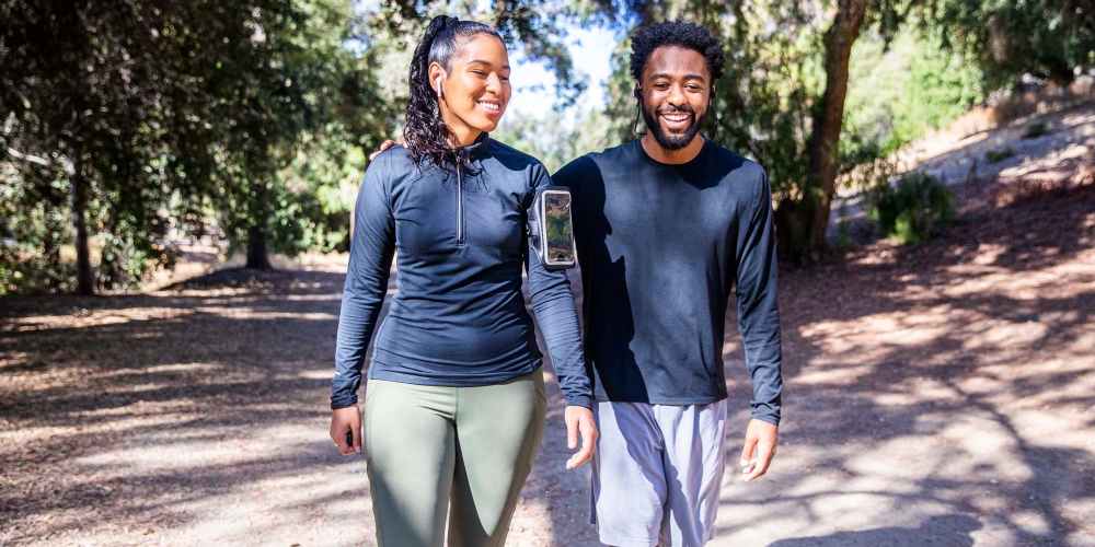 Residents walking in park new at The Breeze in Winter Haven, Florida