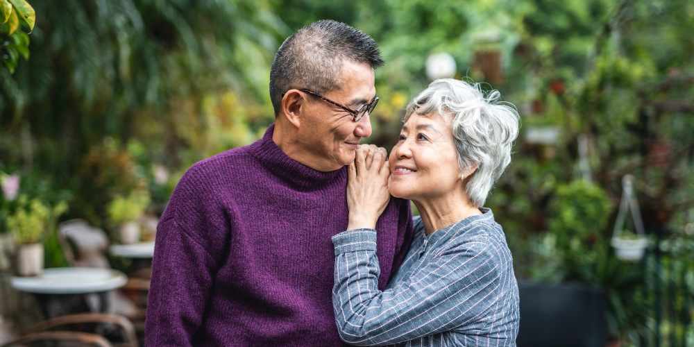 Woman hugging her husband from behind at The Residences at Thomas Circle in Washington, District of Columbia