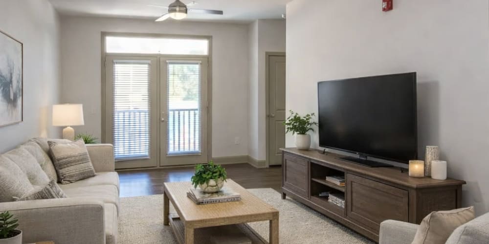Fully equipped kitchen with granite countertops stainless steel appliances like a refrigerator, stove, and drawer microwave at 811 East Downtown in Knoxville, Tennessee 