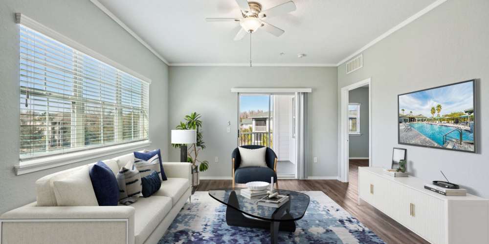 Furnished apartment bedroom with ceiling fan and full size bed at The Parq at Cross Creek in Tampa, Florida