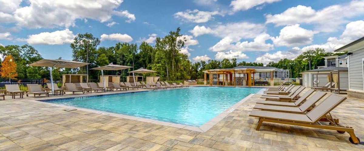Outdoor swimming pool with lounge chairs at The Mark at Wildwood in Oxford, Florida