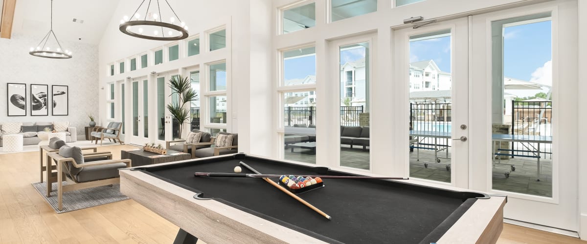 Resident lounge with billiard table at Exchange at St. Augustine in St Augustine, Florida