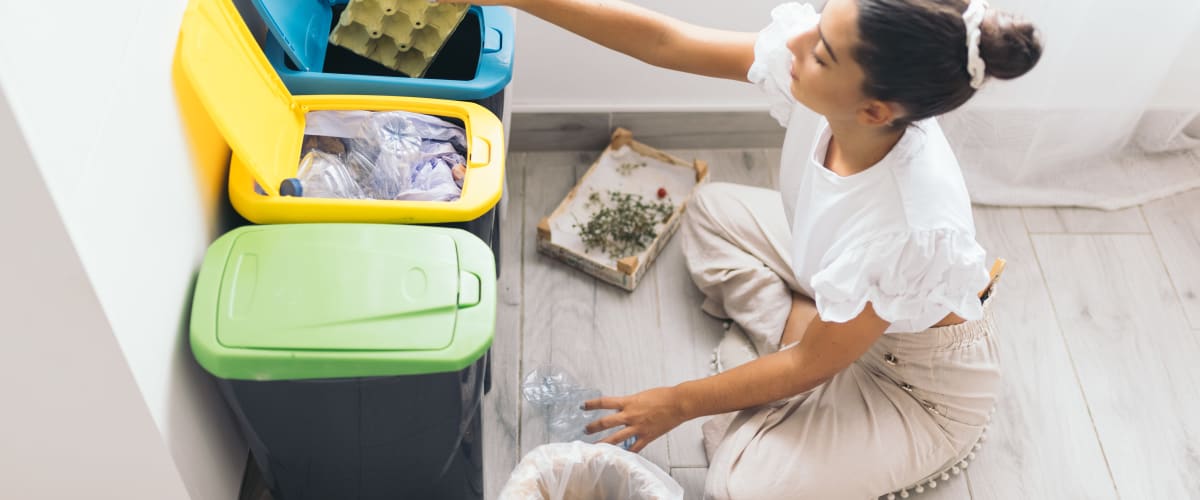 Woman recycling at Solaire 7077 Woodmont in Bethesda, Maryland