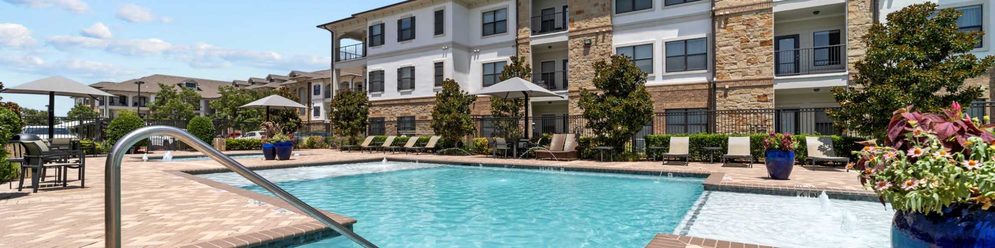 Exterior building with pool at Sorrel Phillips Creek Ranch in Frisco, Texas