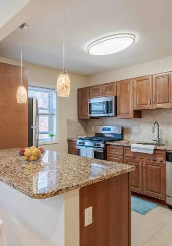 Kitchen with ample counter space at Pompton Gardens in Cedar Grove, New Jersey
