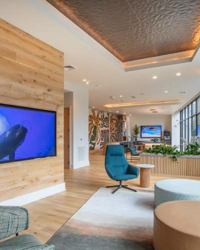Club Room with lots of seating and a TV at The Row in Raleigh,North Carolina