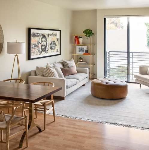 Living room with attached balcony at 1801L Apartments in Sacramento, California