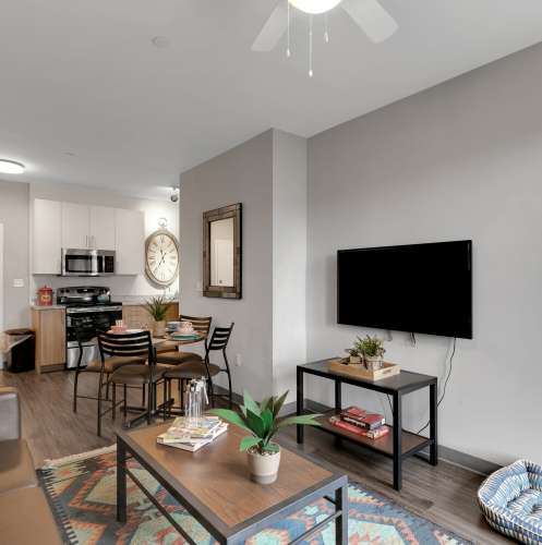 Living room with a television at The Edge in Pensacola, Florida