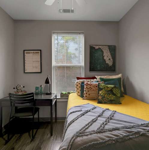 Bedroom with proper lighting at The Edge in Pensacola, Florida