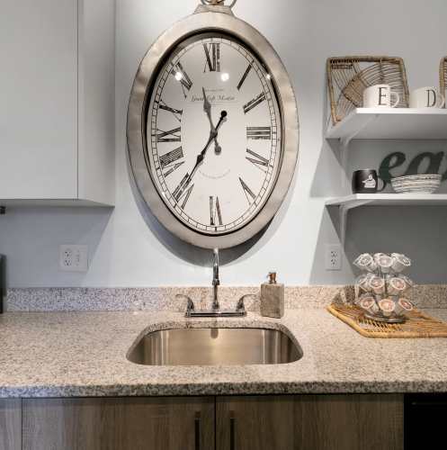 Sink and a huge clock at The Edge in Pensacola, Florida
