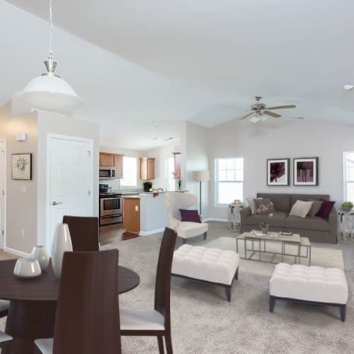 Open concept model living room and kitchen at Webster Green in Webster, New York