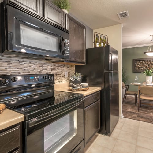 Gourmet kitchen with granite countertops in a model home at Olympus Hillwood in Murfreesboro, Tennessee