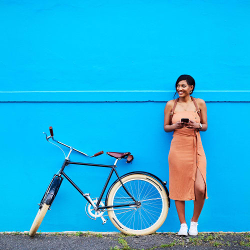 Resident taking a break from her bike ride near Brooklyn Yard in Portland, Oregon