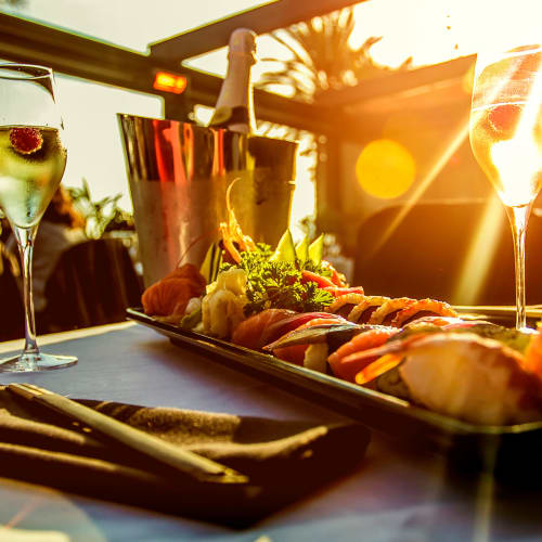 Beautifully presented appetizer and flute of champagne at one of the restaurants near Portside Ventura Harbor in Ventura, California