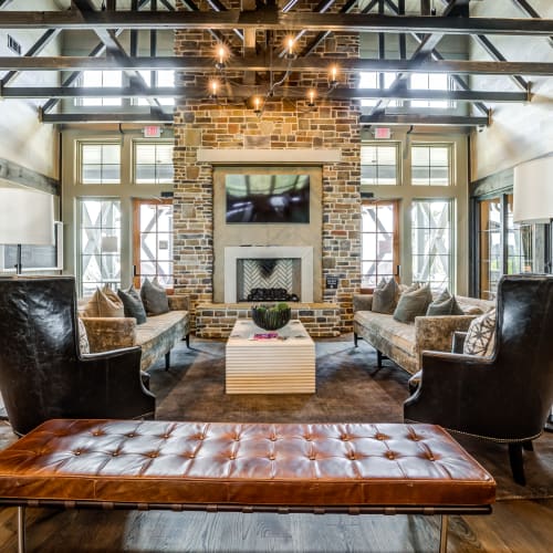 Cozy clubhouse area with large couches to sit on at Rivertop Apartments in Nashville, Tennessee