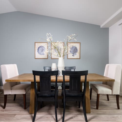 Large dining area with an accent wall in a live/work space at Portside Ventura Harbor in Ventura, California