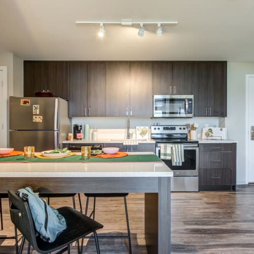 Kitchen with stainless steel appliances at IDENTITY Miami in Miami, Florida