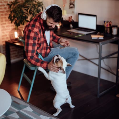 Resident petting his dog at IDENTITY Moscow in Moscow, Idaho
