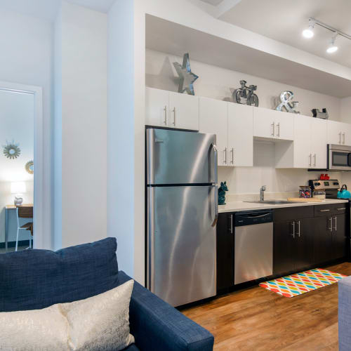Kitchen with stainless steel appliances at INFINITE in Chicago, Illinois