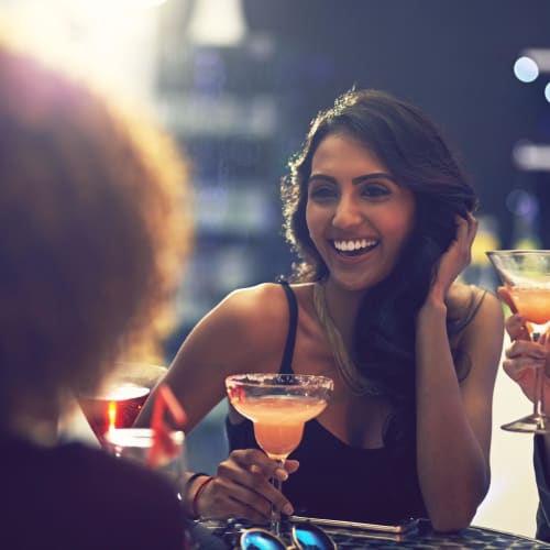 Resident friends out for a drink in the evening at their favorite hot spot near Hyde Park at Montfort in Dallas, Texas