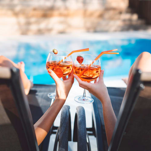 Resident friends toasting the good life by the swimming pool at 860 South in Stockbridge, Georgia