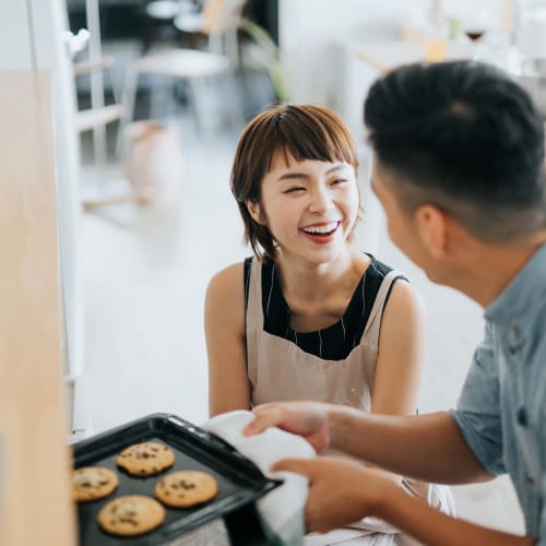 Residents baking in their chef-inspired kitchen at Reserve at Peachtree Corners in Norcross, Georgia