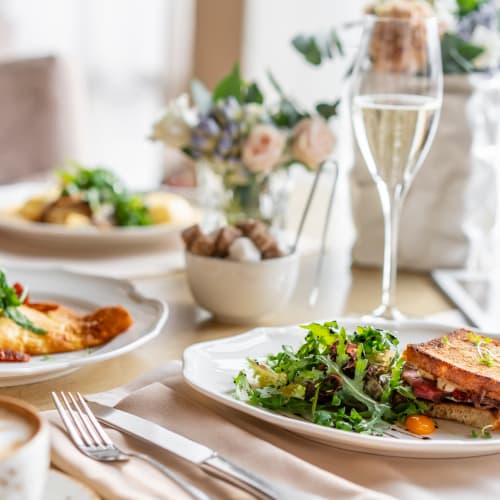 Dinner table with various dishes set at Saddlebrook Oxford Memory Care in Frisco, Texas