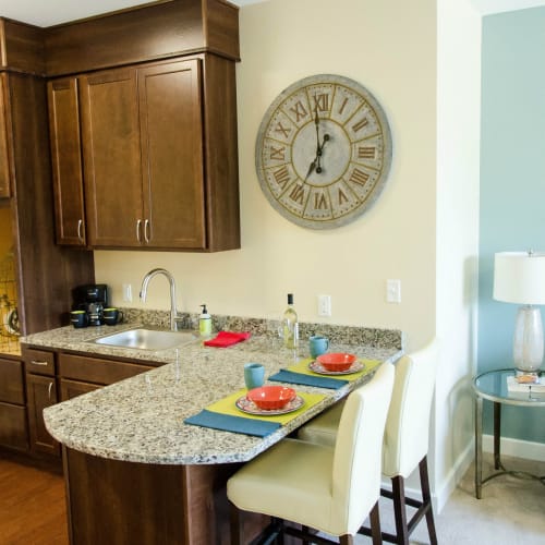 Kitchenettes with granite counter tops available at First & Main of Auburn Hills in Auburn Hills, Michigan