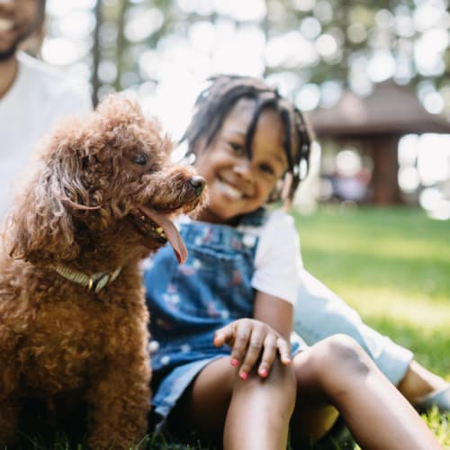Resident petting her dog outside of 900 Dwell in Stockbridge, Georgia