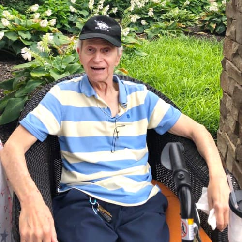 Resident sitting outside at The Oxford Grand Assisted Living & Memory Care in Kansas City, Missouri