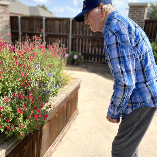 Happy resident in the garden at Oxford Senior Living in Wichita, Kansas