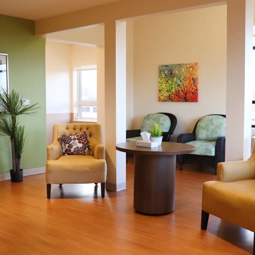 Tranquil sunroom with spacious seating at First & Main of Bloomfield Township in Bloomfield Township, Michigan