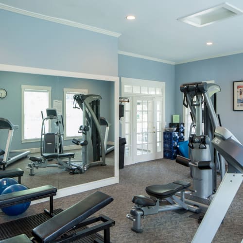 Cardio machines and weights in the high-tech fitness center at The Preserve at Beckett Ridge Apartments & Townhomes in West Chester, Ohio