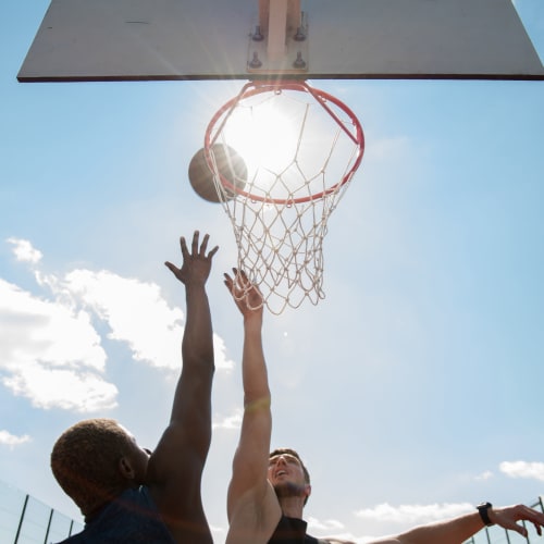 Residents playing a game of basketball at Mandalane Apartments in Wheeling, Illinois