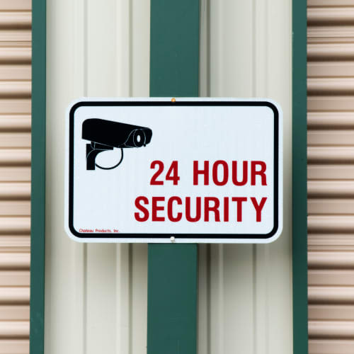 Sign for 24-hour security cameras at Red Dot Storage in Vicksburg, Mississippi