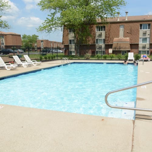 A large swimming pool with lounge chairs at Northgate Meadows Apartments in Cincinnati, Ohio