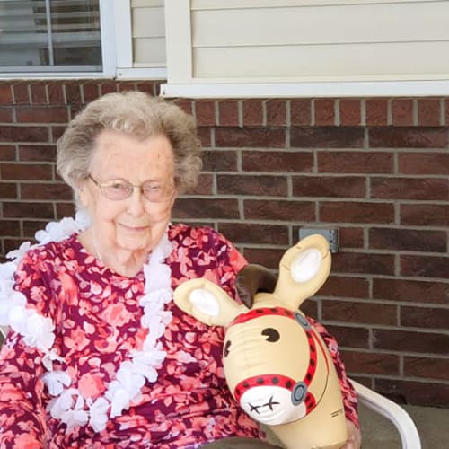 A resident with a horse toy at Homestead House in Beatrice, Nebraska