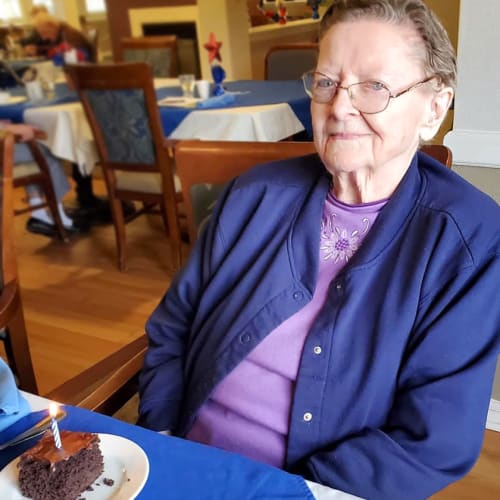 A happy resident with a dessert at Homestead House in Beatrice, Nebraska