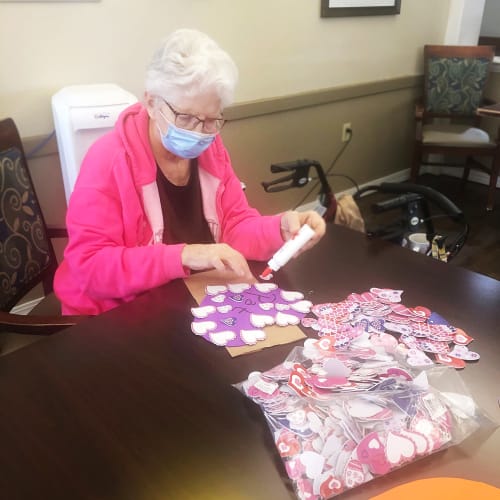 Resident making Valentines Day crafts at Madison House in Norfolk, Nebraska