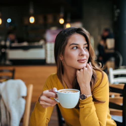 Resident drinking a cup of coffee near Skyline West in Atlanta, Georgia