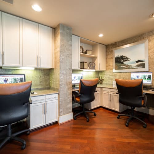 Executive business center with workstations at Marquis at Texas Street in Dallas, Texas