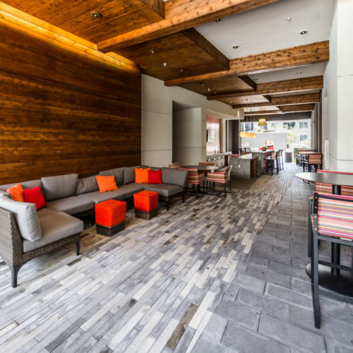 Thruway with lounge couches and dining bar tables and chairs of Marq on Burnet in Austin, Texas