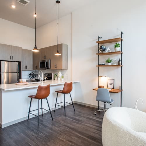 Living room and kitchen at Marq Iliff Station in Aurora, Colorado