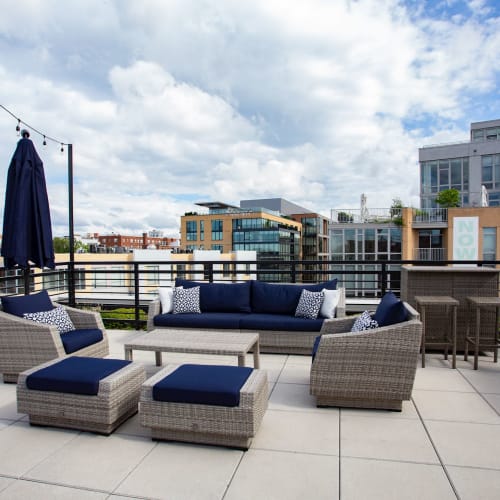 Outdoor lounge area with comfy seating for residents at 1350 Florida in Washington, District of Columbia