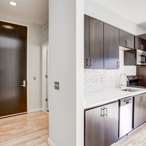 Kitchen and entryway with gorgeous hardwood floors at 1350 Florida in Washington, District of Columbia