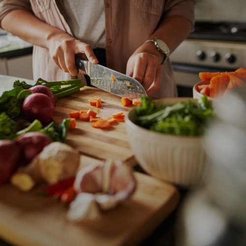 Chopping up some fresh ingredients at home at 1630 R St NW in Washington, District of Columbia